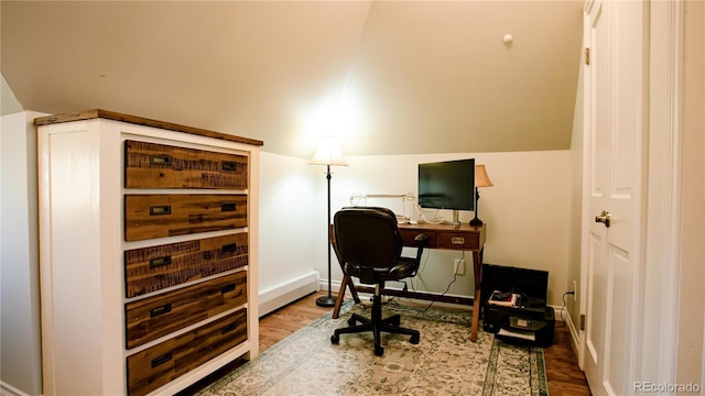 2335 Stout St, Denver, CO 80205 - office area with wood finished floors, lofted ceiling, and baseboards