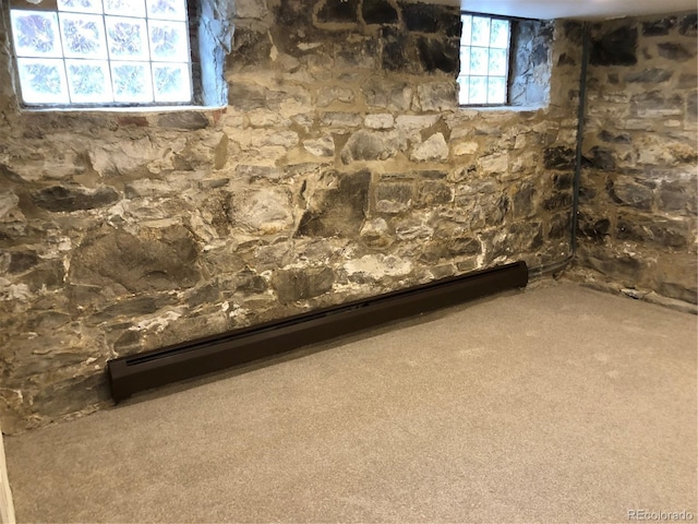 2335 Stout St, Denver, CO 80205 - basement featuring a baseboard heating unit