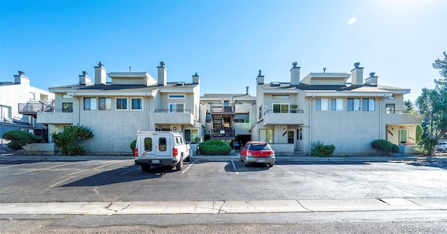 multi unit property featuring a balcony