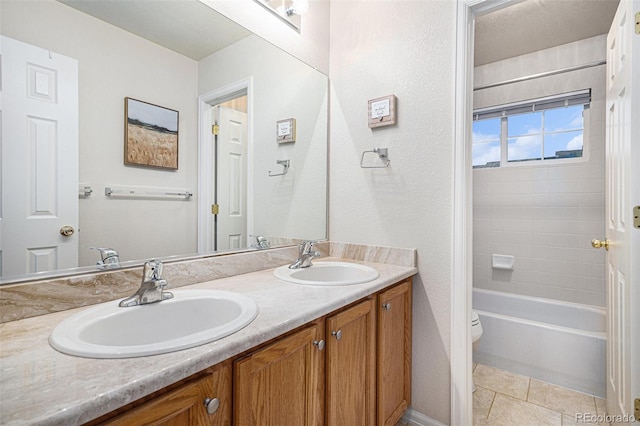 full bathroom with shower / bath combination, toilet, vanity, and tile patterned flooring