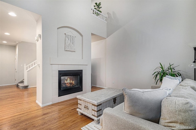 living room featuring a fireplace and light hardwood / wood-style floors