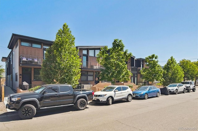 view of front of property with a balcony