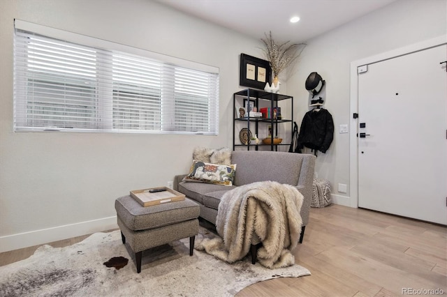 sitting room with light hardwood / wood-style flooring