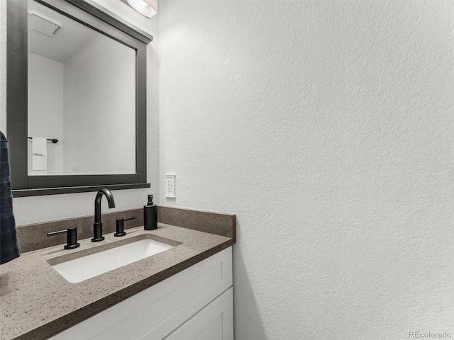 19726 Applewood Ct, Parker, CO 80138 - bathroom featuring a textured wall and vanity
