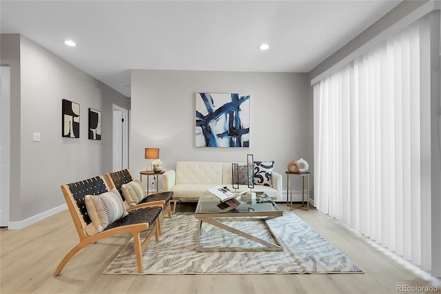 10150 Virginia Ave Unit 103, Denver, CO 80247 - living area with light wood finished floors, recessed lighting, and baseboard heating