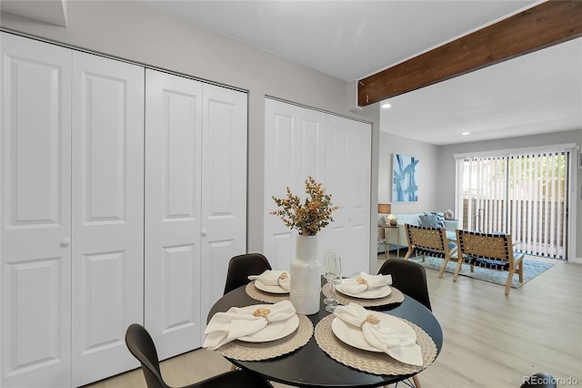 10150 Virginia Ave Unit 103, Denver, CO 80247 - dining space featuring light wood-type flooring, beamed ceiling, and recessed lighting