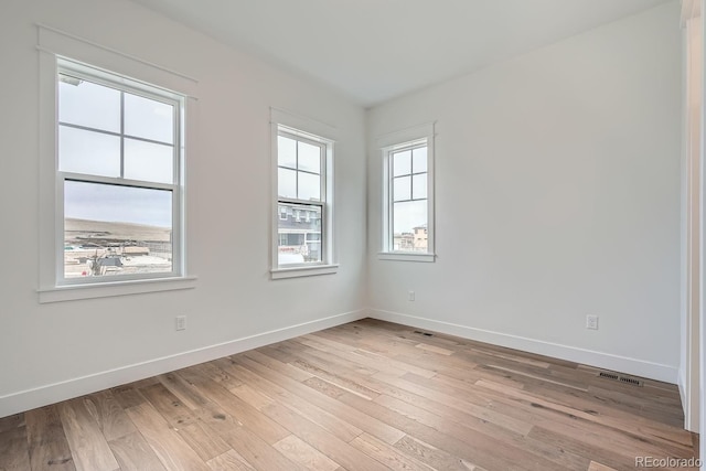 empty room featuring light hardwood / wood-style floors