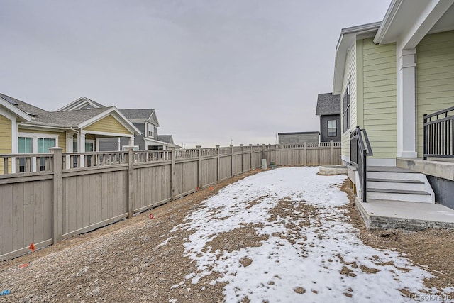 view of yard layered in snow