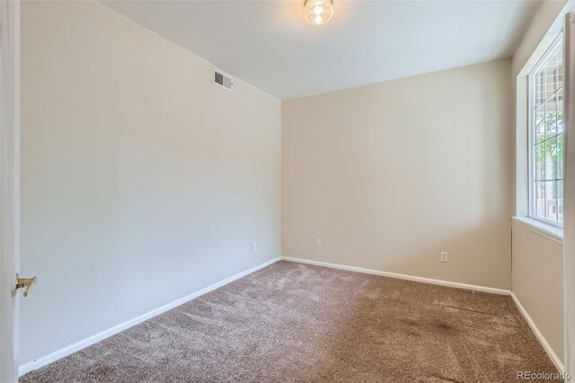 4222 S Blackhawk Cir Unit 6G, Aurora, CO 80014 - empty room with carpet and baseboards