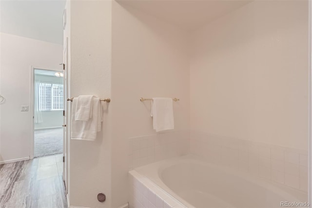 4222 S Blackhawk Cir Unit 6G, Aurora, CO 80014 - full bath with a garden tub and baseboards