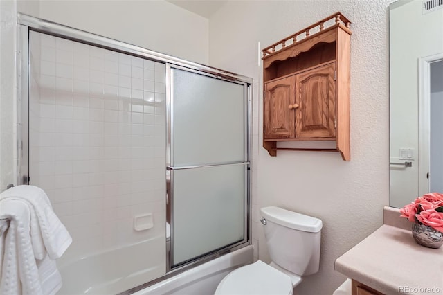 4222 S Blackhawk Cir Unit 6G, Aurora, CO 80014 - bathroom with shower / bath combination with glass door, toilet, and vanity