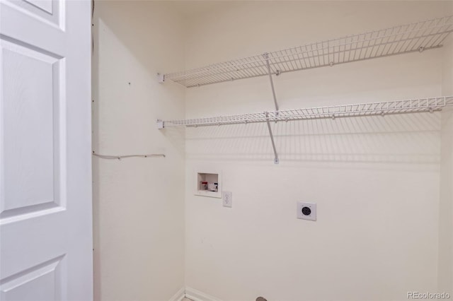 4222 S Blackhawk Cir Unit 6G, Aurora, CO 80014 - laundry area featuring hookup for an electric dryer, washer hookup, and baseboards