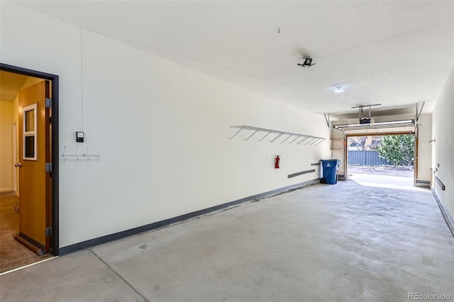 4222 S Blackhawk Cir Unit 6G, Aurora, CO 80014 - garage featuring baseboards and a garage door opener