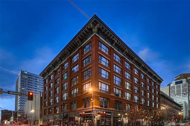 view of outdoor building at dusk