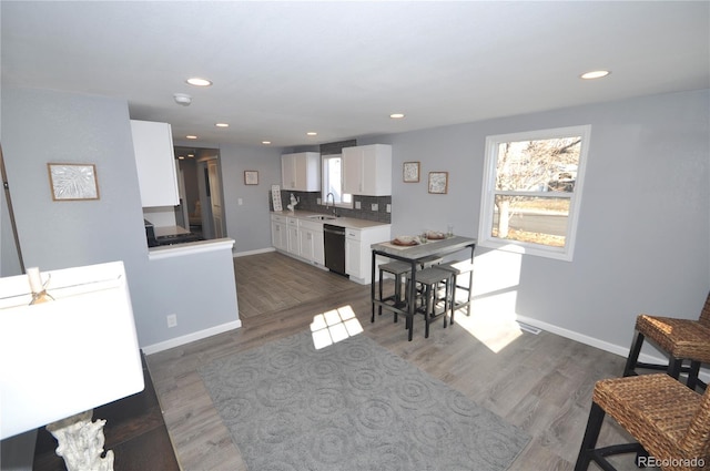 interior space with sink and dark wood-type flooring