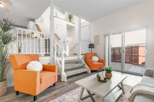 living room featuring stairs and wood finished floors