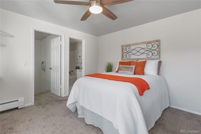 carpeted bedroom with ensuite bathroom, baseboards, a baseboard heating unit, and a ceiling fan