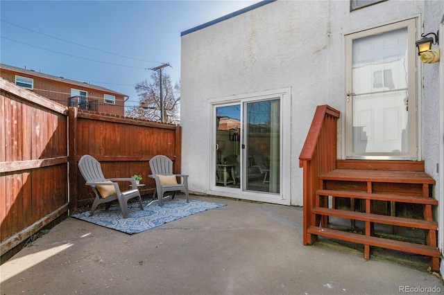 view of patio / terrace featuring fence