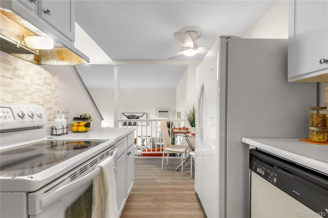 kitchen featuring under cabinet range hood, white appliances, light wood-style floors, light countertops, and ceiling fan