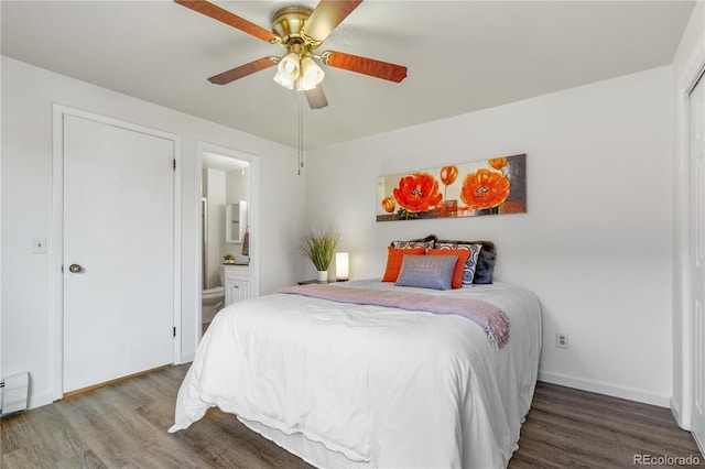 bedroom featuring ceiling fan, baseboards, ensuite bath, and wood finished floors