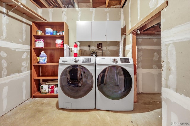 laundry area featuring cabinet space and separate washer and dryer