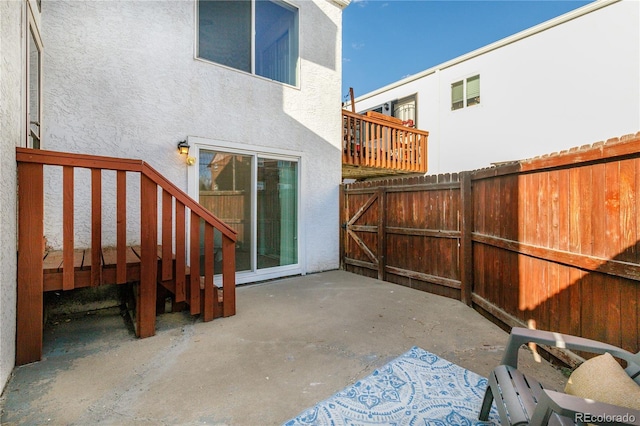 view of patio featuring fence