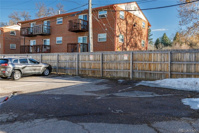 uncovered parking lot with fence