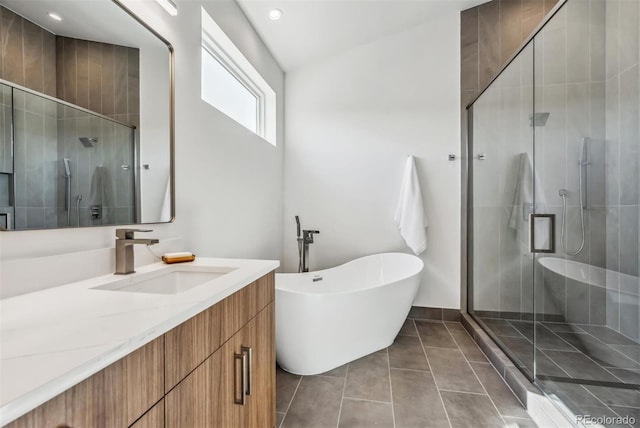 bathroom featuring tile patterned flooring, shower with separate bathtub, lofted ceiling, and vanity