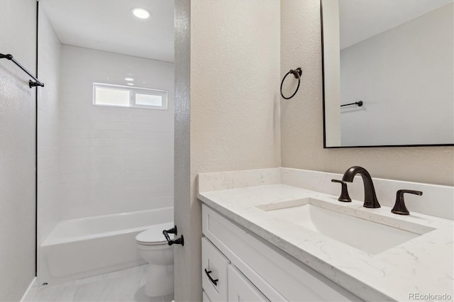 full bathroom with toilet, vanity, and shower / tub combination