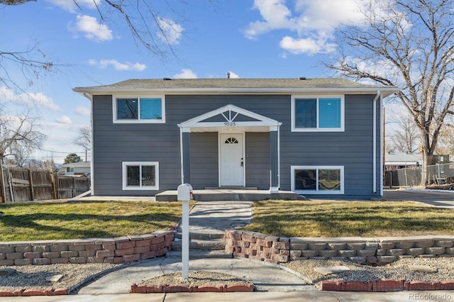 bi-level home featuring a front yard