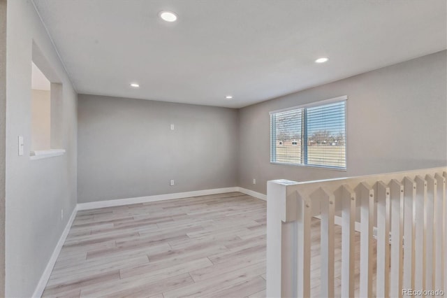 unfurnished room with light hardwood / wood-style floors