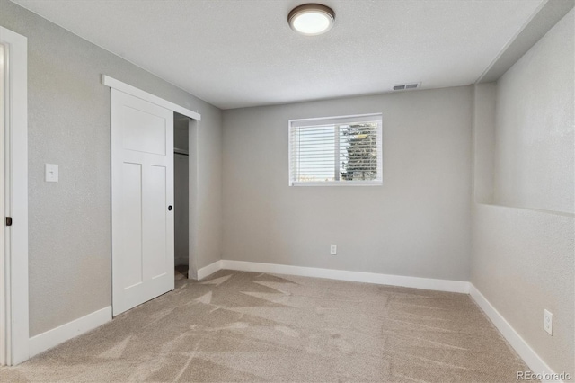 unfurnished bedroom with light carpet