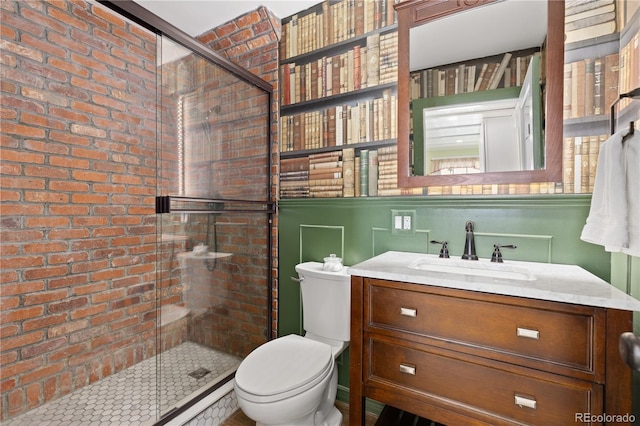 7835 Valley View St, Louviers, CO 80131 - full bath with a shower stall, vanity, toilet, and brick wall