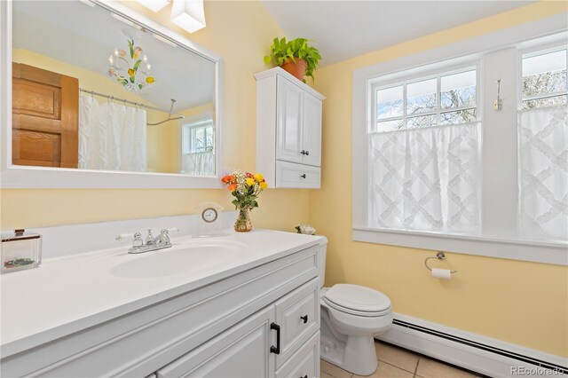 7835 Valley View St, Louviers, CO 80131 - full bath with a baseboard heating unit, healthy amount of natural light, tile patterned floors, and vanity