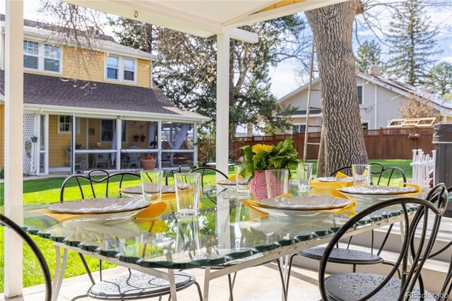 7835 Valley View St, Louviers, CO 80131 - wooden deck featuring a sunroom and a patio