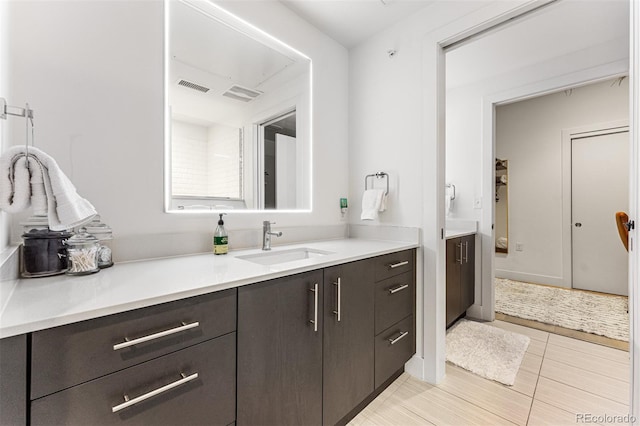 bathroom featuring vanity and tile patterned flooring