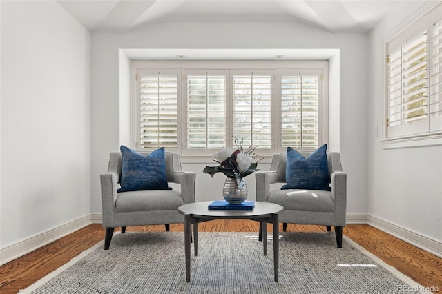 sitting room featuring baseboards and wood finished floors