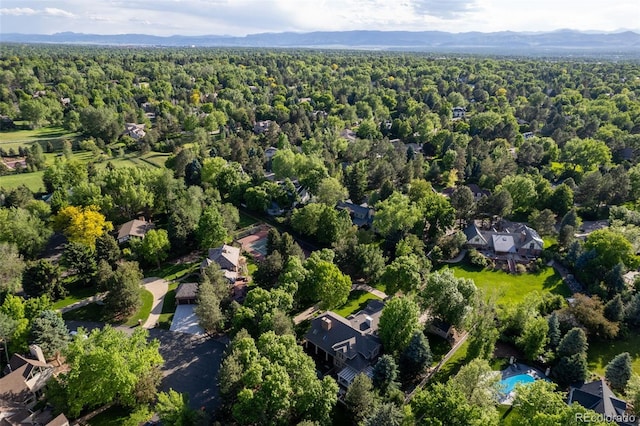 aerial view with a mountain view and a view of trees