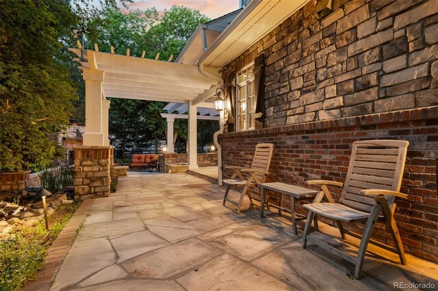 view of patio featuring a pergola