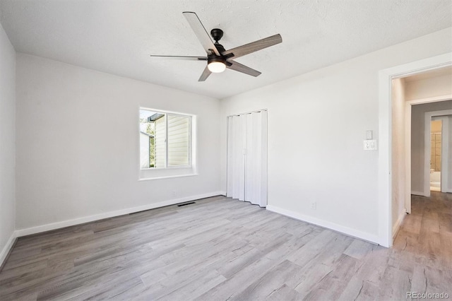 16707 W 10th Ave, Golden, CO 80401 - unfurnished bedroom featuring wood finished floors, a closet, and ceiling fan