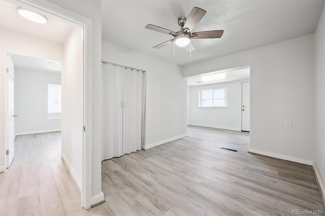 16707 W 10th Ave, Golden, CO 80401 - unfurnished bedroom featuring wood finished floors, a closet, and a ceiling fan