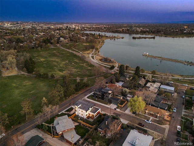 aerial view of property and surrounding area with a large body of water