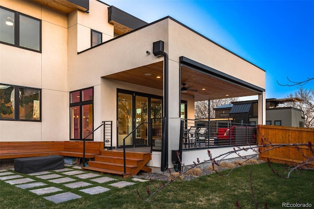 back of house featuring stucco siding
