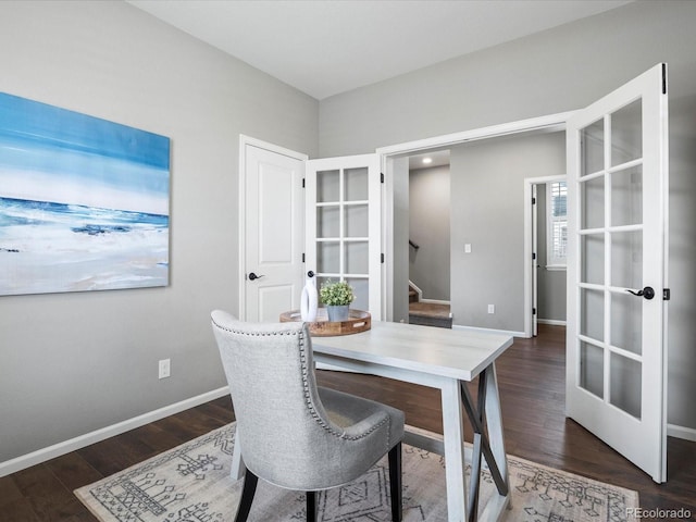 office with dark hardwood / wood-style flooring and french doors