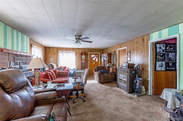 living room with ceiling fan and carpet