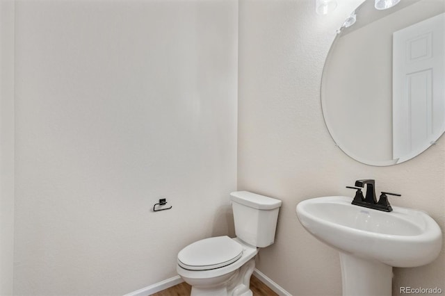 bathroom with sink and toilet