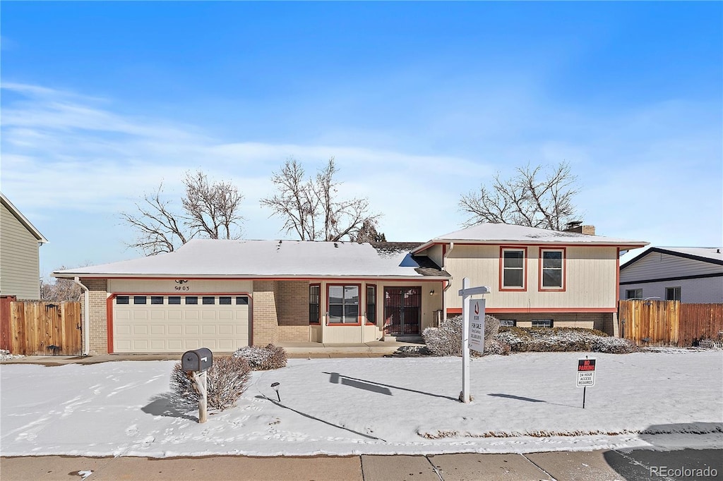 split level home featuring a garage