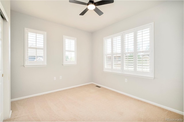 7777 E 23rd Ave Unit 1401, Denver, CO 80238 - carpeted spare room with baseboards and a ceiling fan