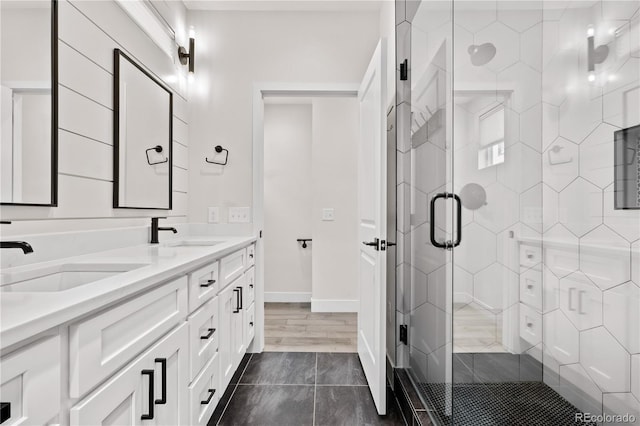 bathroom with walk in shower and vanity