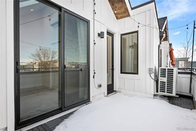 view of snow covered property entrance